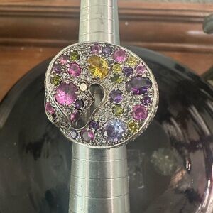 Sterling silver ribbon swirl statement ring with multi color crystals